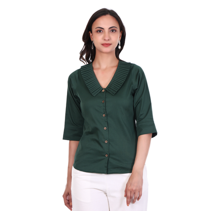 Woman wearing a green blouse with pleated collar quarter sleeves