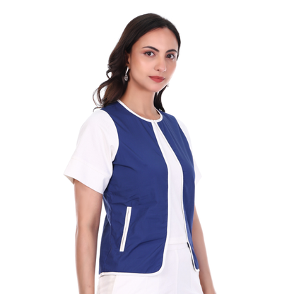 Woman wearing a blue and white top on a white background